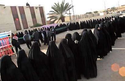 Iraqi women waiting to vote