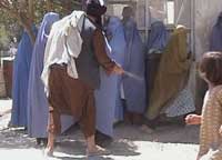 Taliban beating woman